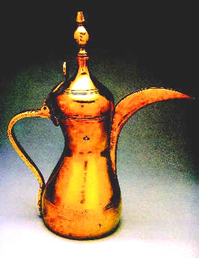 An Arabian Dullah--traditional Bedouin brass coffee pot